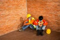 Asian workers construction wear protective face masks for safety are worrying about unemployment in construction site