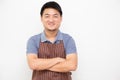 Asian workers fresh market with brown apron standing with arms crossed isolated on white background