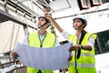 Asian workers people walking and checking onsite of architecture building straucture and work progress. Male and female engineers Royalty Free Stock Photo