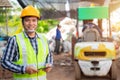 Asian workers in recycling factory with a forklift on the background, engineers standing in recycling center. Recycle waste,