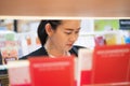 Asian working woman in a book store Royalty Free Stock Photo