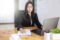 Asian working woman concept, Asian woman with long black hair wearing a suit, Working with laptop computers and boards Royalty Free Stock Photo