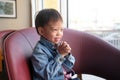 Asian 3 - 4 years old toddler boy child praying, hands clasped together for prayer at home,  World Day of Prayer concept Royalty Free Stock Photo