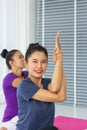 Yoga teachers teach students one-on-one in the gym to be healthy and strong