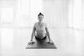 Asian yogi woman practicing yoga stretching in Cobra exercise, Bhujangasana pose, working out,monochrome Royalty Free Stock Photo