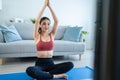 Asian young beautiful active woman doing Yoga Pilates workout at home. Attractive girl in sportswear feel happy and relax, follow