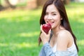 Asian young beautiful girl with red apple Royalty Free Stock Photo
