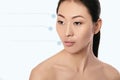 Asian young, beautiful and natural woman with dotted arrows on her face Royalty Free Stock Photo