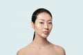 Asian young, beautiful and natural woman with dotted arrows on her face Royalty Free Stock Photo