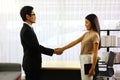 Asian young business man handshaking with new partner young business woman Royalty Free Stock Photo