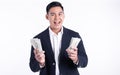 Asian young business man holding money with happy face Royalty Free Stock Photo