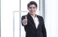 A business man is successfully smiling and thumb up Royalty Free Stock Photo