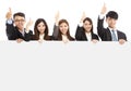 Asian young business people holding white board and thumb up Royalty Free Stock Photo