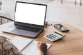 Asian young business woman of student holding a pen writing letter on paper and white mock up screen laptop at home Royalty Free Stock Photo