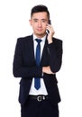 Asian young Businessman chat on mobile phone Royalty Free Stock Photo