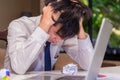 Asian young businessman failing and stressed in office