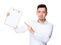 Asian Young Businessman pen point to clipboard Royalty Free Stock Photo