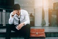 Asian young businessman stress sitting in front office with his Royalty Free Stock Photo