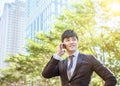 Asian young businessman talking on mobile phone Royalty Free Stock Photo