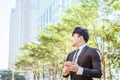 Asian young businessman using mobile phone Royalty Free Stock Photo