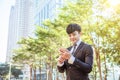 Asian young businessman using mobile phone Royalty Free Stock Photo