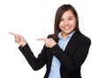 Asian Young Businesswoman with finger point aside Royalty Free Stock Photo