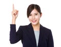 Asian young businesswoman finger point up