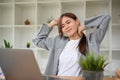 Asian young businesswoman relaxing and stretching her arms and neck after work Royalty Free Stock Photo