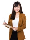 Asian Young Businesswoman take note on clipboard Royalty Free Stock Photo
