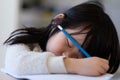 Asian young child fall asleep during study