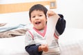 Asian young child wakes up in the morning on the bedroom. Royalty Free Stock Photo