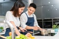 Asian Young couple cooking in kitchen at home Royalty Free Stock Photo