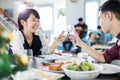 Asian young couple enjoying a romantic dinner evening drinks wh Royalty Free Stock Photo