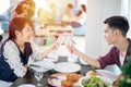 Asian young couple enjoying a romantic dinner  evening drinks while sitting at the dinning table on the kitchen together Royalty Free Stock Photo