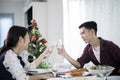 Asian young couple enjoying a romantic dinner evening drinks wh Royalty Free Stock Photo