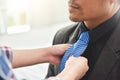 Asian young couple getting dressed. Royalty Free Stock Photo