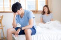 Asian young couple having problem of man worried impotent and unhappy at bedroom Royalty Free Stock Photo