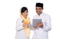 Asian young couple muslim using tablet pc