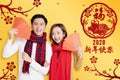 Asian young couple showing red envelopes for chinese new year.chinese text happy new year 2020 Royalty Free Stock Photo