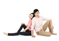 Asian young couple sitting on floor isolated on white background Royalty Free Stock Photo