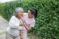 Asian young daughter caring for  sick senior mother To suffering chest pain or Heart attack at home . old mom suffering from Royalty Free Stock Photo