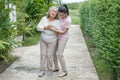 asian young daughter caring for sick senior mother To suffering chest pain or Heart attack at home . old mom suffering from Royalty Free Stock Photo