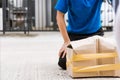 Delivery man he emotional courier hold damaged cardboard box is broken Royalty Free Stock Photo