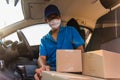 Delivery man courier online with boxes with uniform sitting in driving car Royalty Free Stock Photo