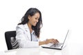 Asian young doctor smiling and working on her laptop Royalty Free Stock Photo