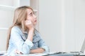 Asian young employee thinking in office Royalty Free Stock Photo