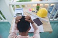 Asian young engineer man stress and failure in architecture project sitting at office on construction site. Upset despair civil Royalty Free Stock Photo