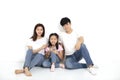 Asian Young family Sitting On Floor Royalty Free Stock Photo