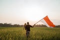 Asian young father with doughter flapping Indonesian flag Royalty Free Stock Photo