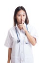 Asian young female doctor do quiet sign.